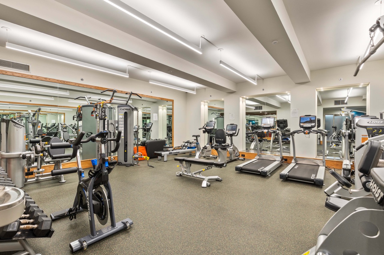 110 East 57th Street, Unit 10CD Manhattan, NY 10022 - Photo 15 of 16 a view of a room with gym equipment