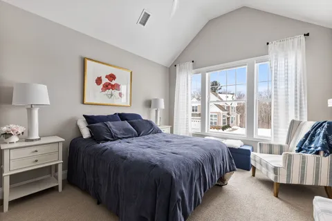 a bed room with a bed and a couch