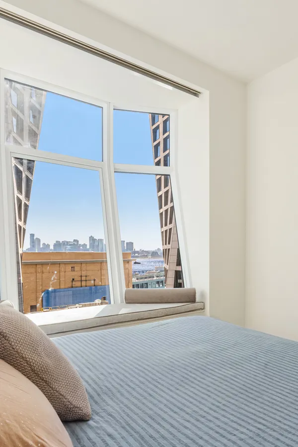 a view of living room with furniture and floor to ceiling window