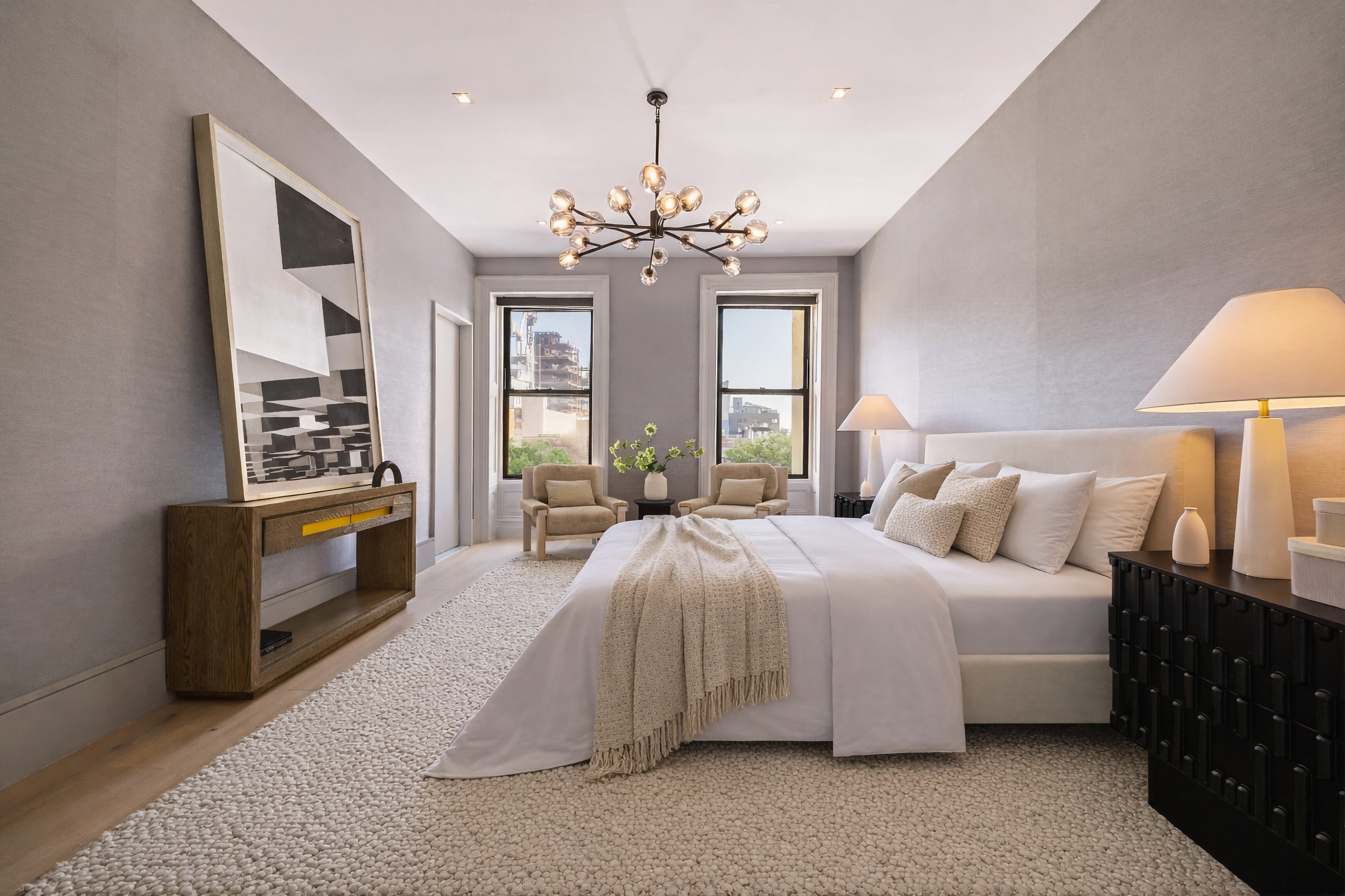 197 Clinton Street Brooklyn, NY 11201 - Photo 14 of 24 a spacious bedroom with a bed and a chandelier