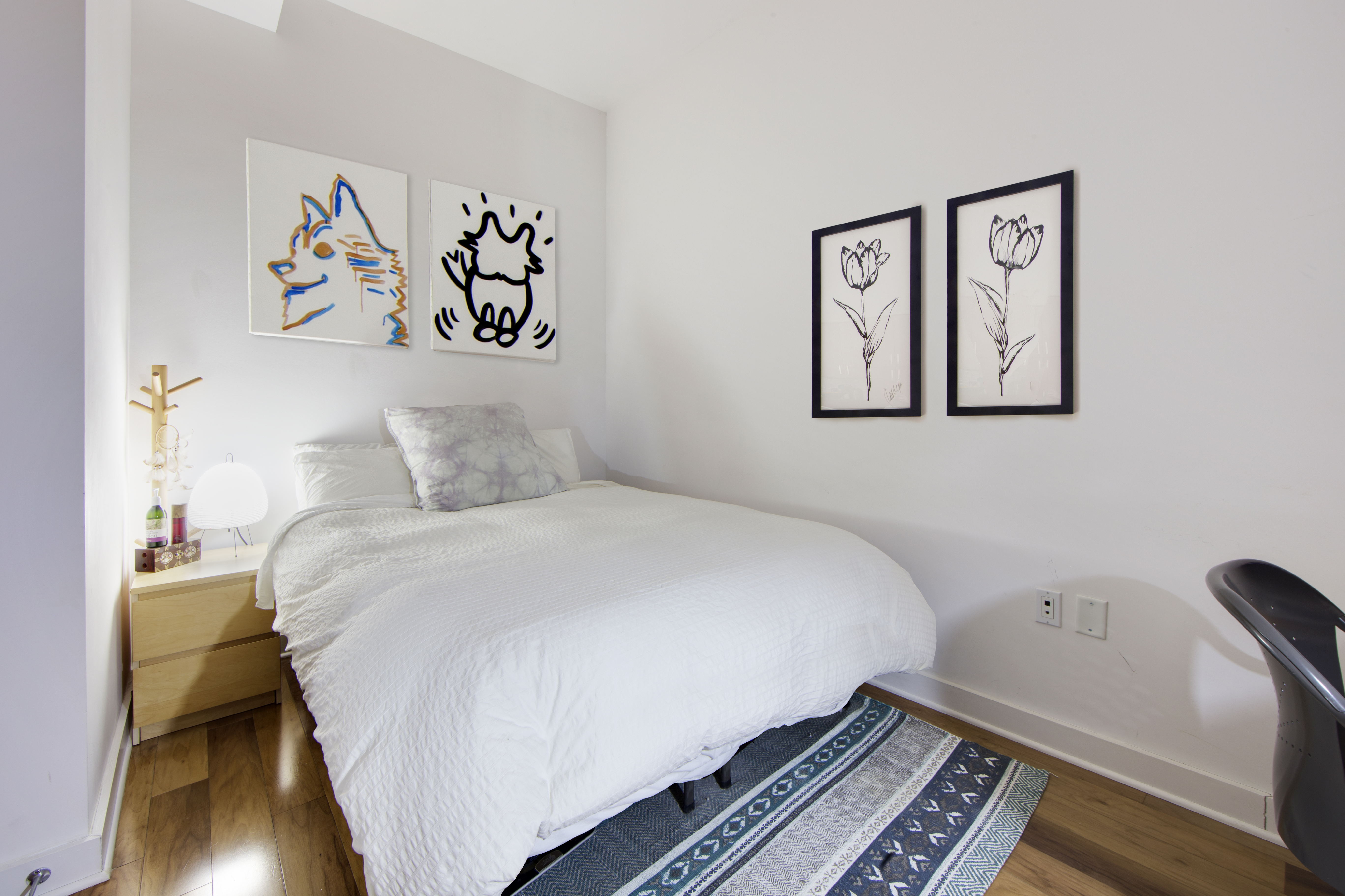 2 Northside Piers, Unit 2O Brooklyn, NY 11249 - Photo 5 of 7 a bedroom with a bed and wooden floor