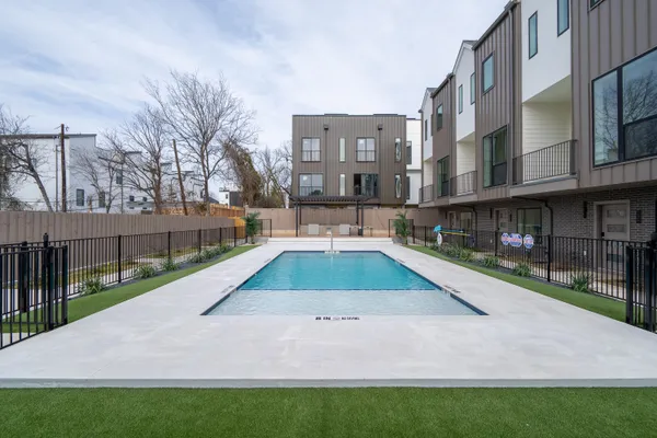 a view of yard with swimming pool and sitting area