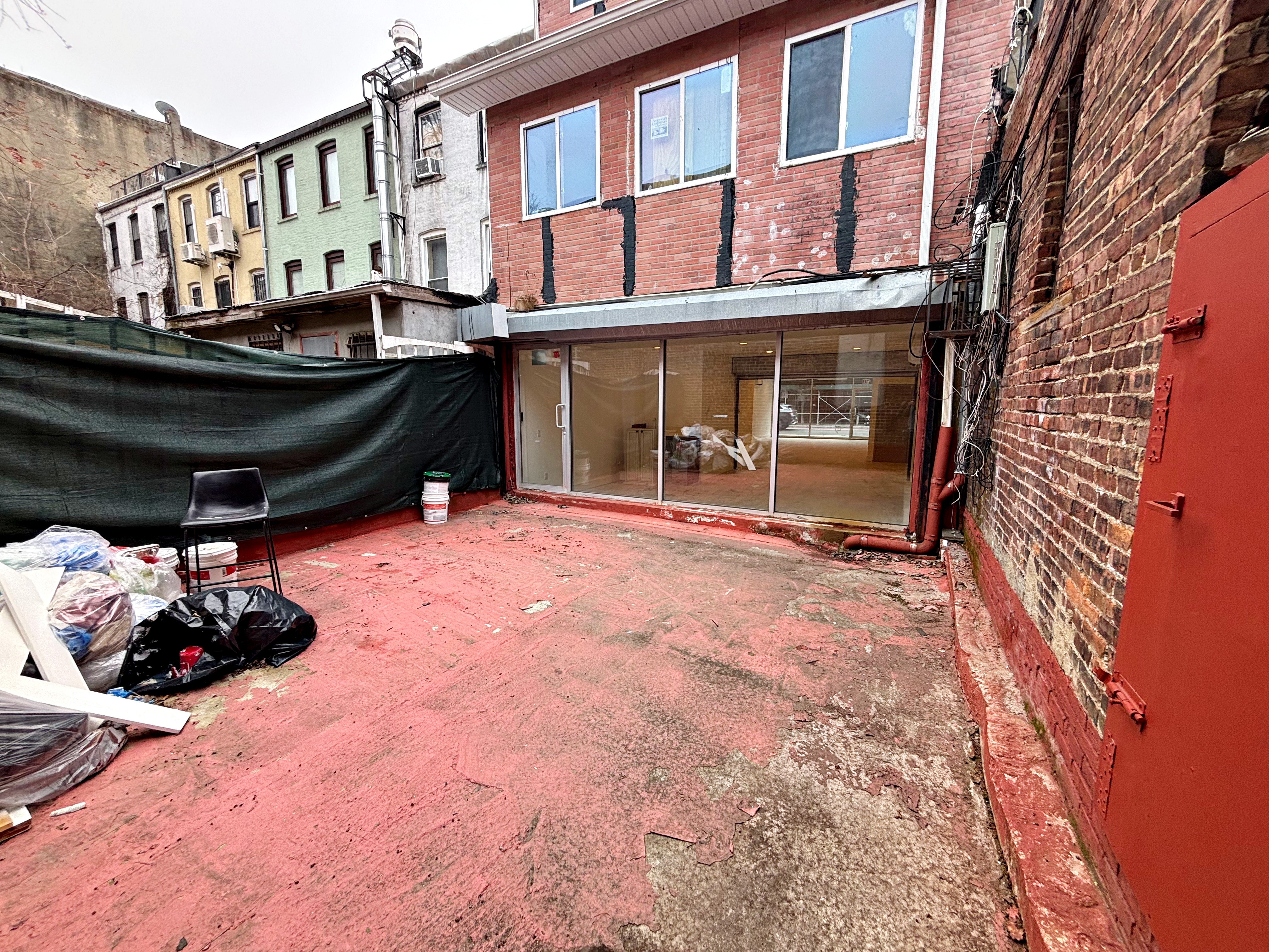 385 Nostrand Avenue, Unit Undisclosed Brooklyn, NY 11216 - Photo 9 of 27 a view of a house with a roof deck