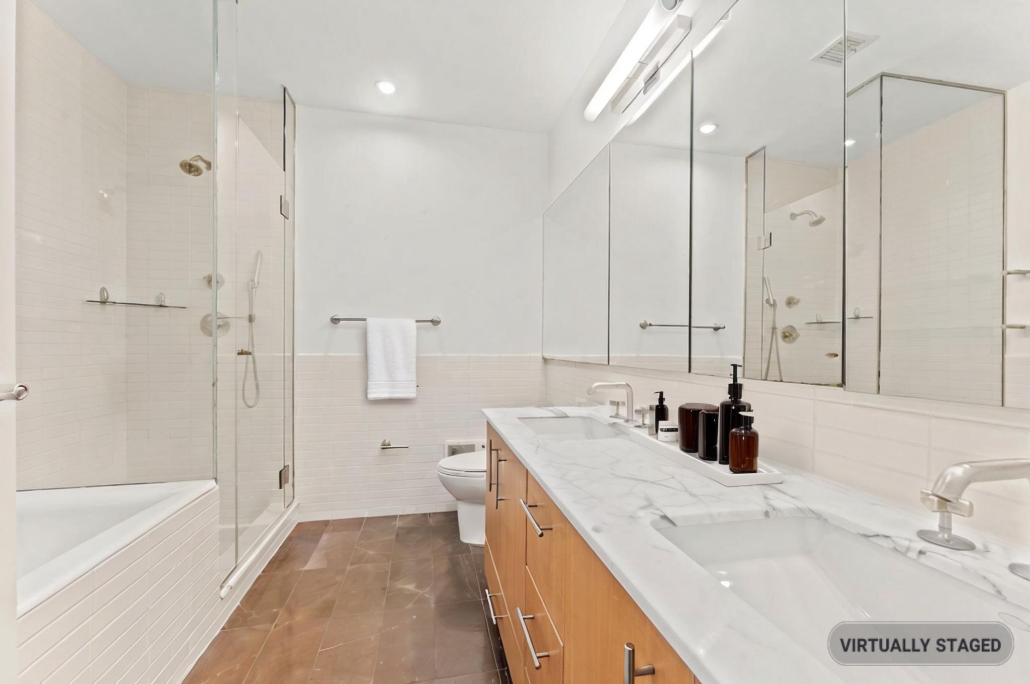 545 West 110th Street, Unit 5A Manhattan, NY 10025 - Photo 5 of 20 a bathroom with a tub sink and mirror