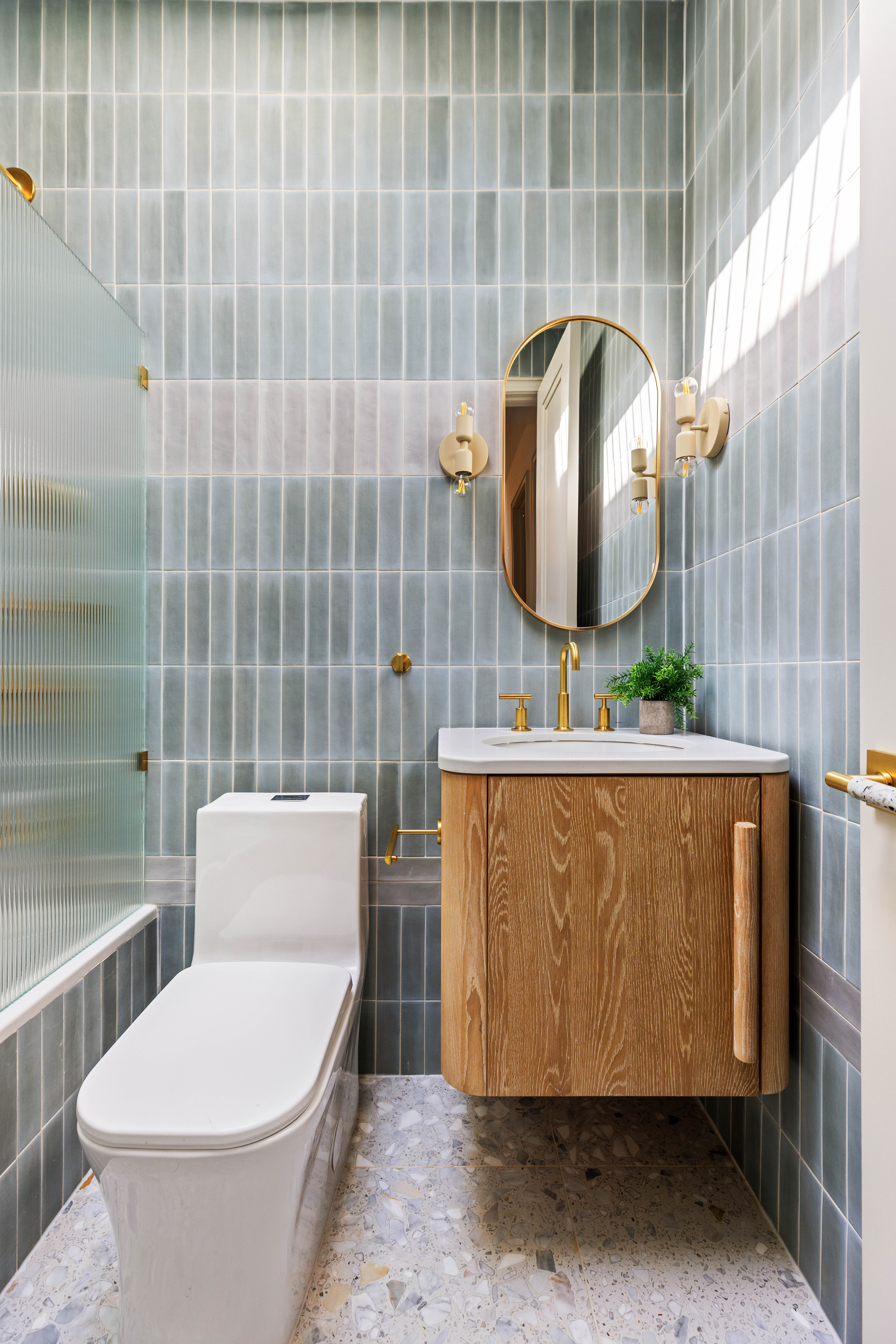 444 Quincy Street Brooklyn, NY 11221 - Photo 11 of 16 a bathroom with a toilet sink and mirror