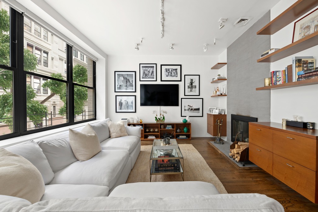 120 West 18th Street, Unit 2A Manhattan, NY 10011 - Photo 3 of 14 a living room with furniture tv and a large window