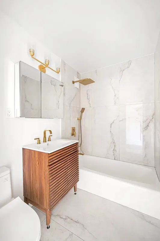 a bathroom with a bathtub and a sink