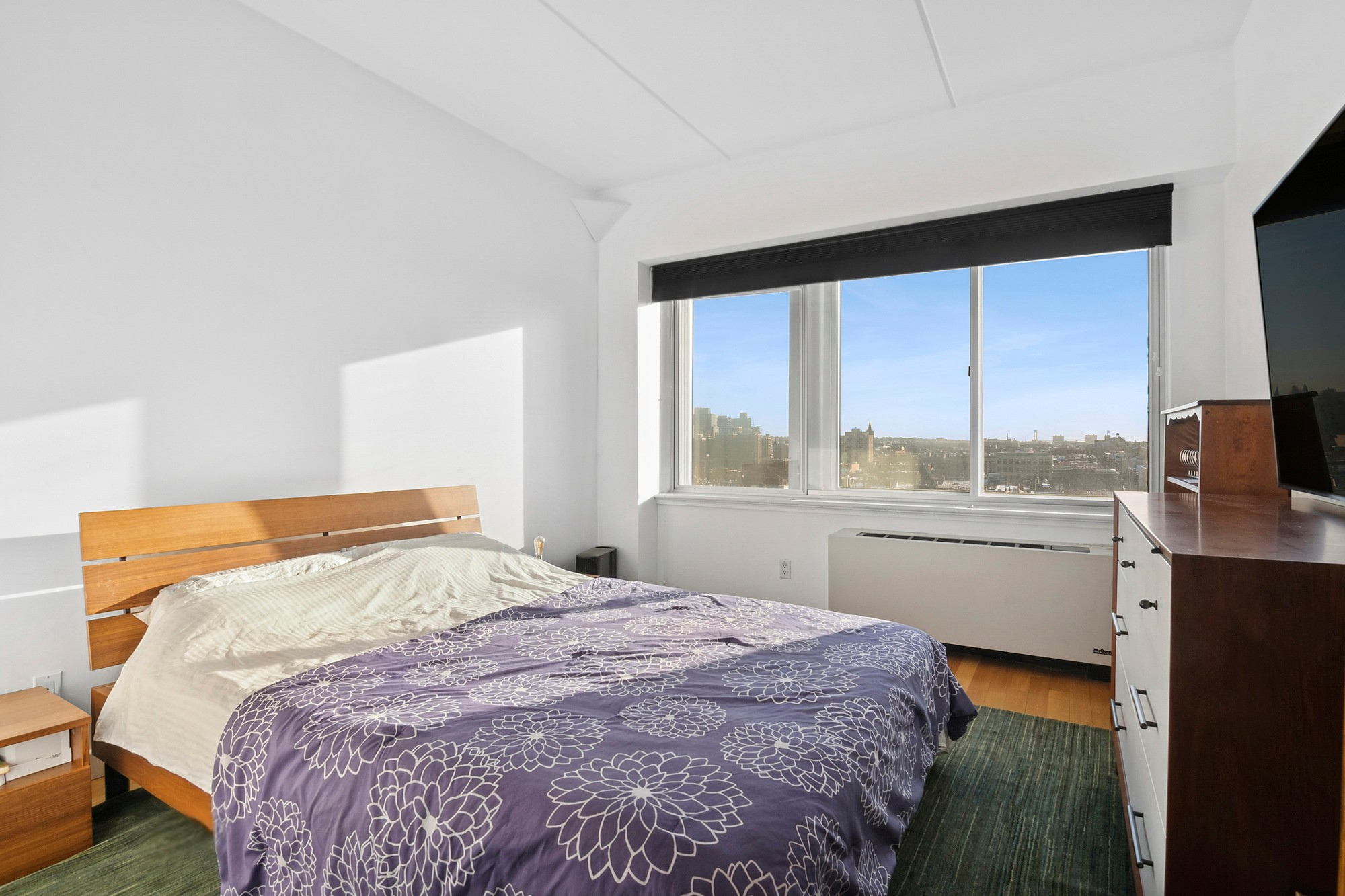 87 Smith Street, Unit 8B Brooklyn, NY 11201 - Photo 5 of 8 a bedroom with a bed and a large window