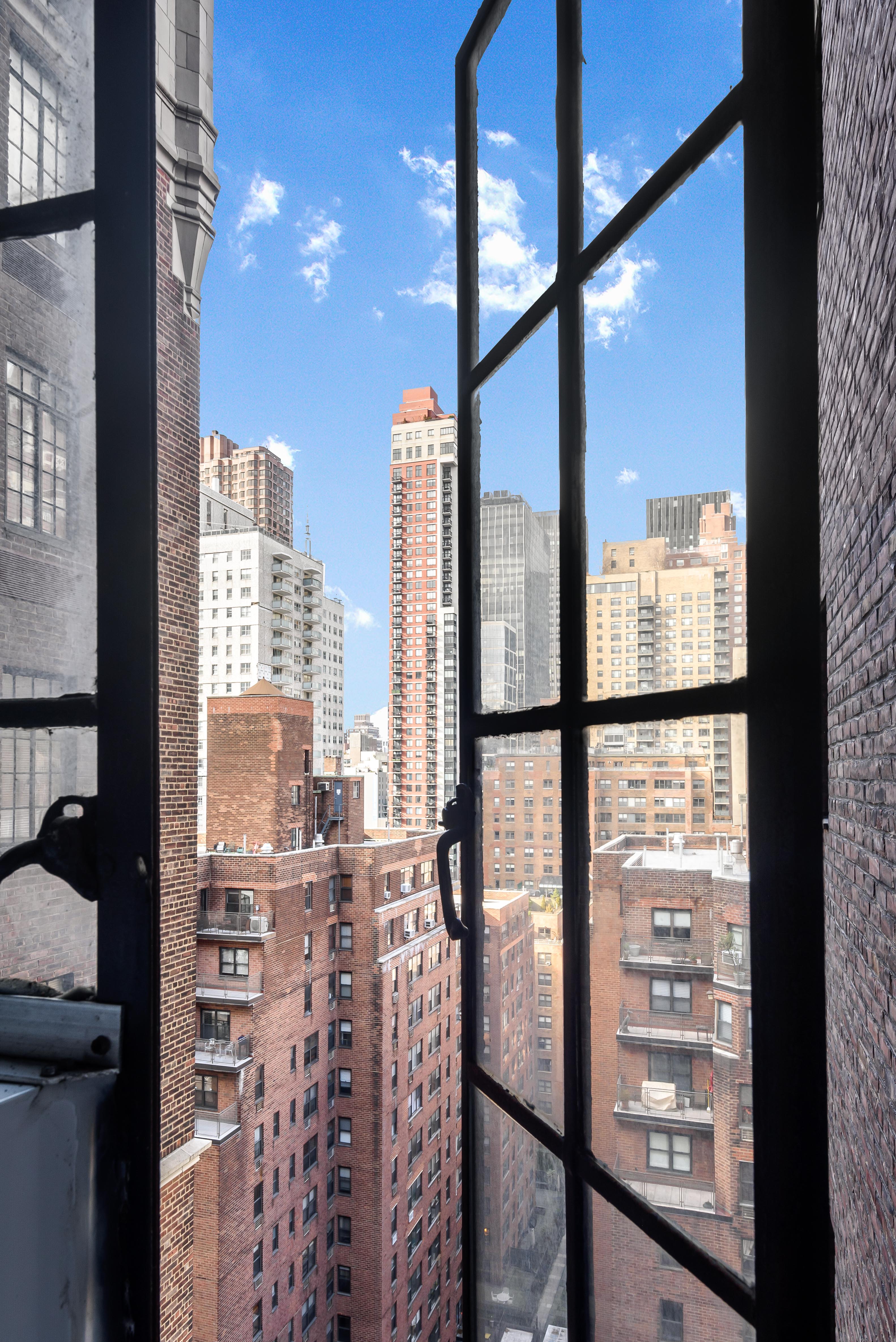 5 Tudor City Place, Unit 1607 Manhattan, NY 10017 - Photo 4 of 5 a view of a city from a balcony