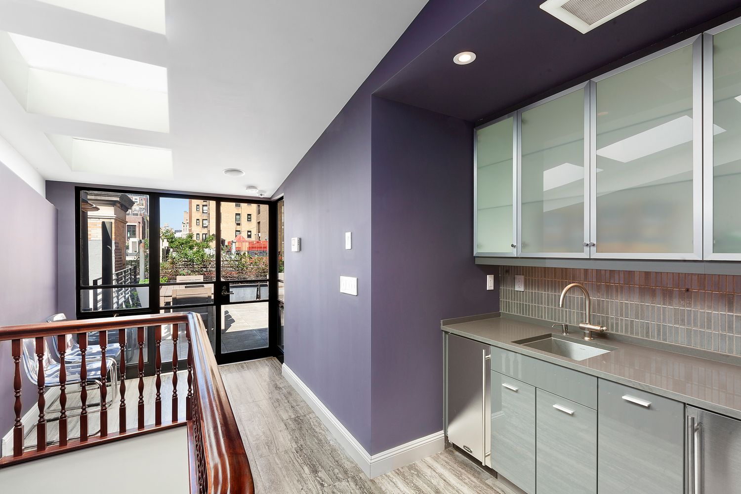 16 East 74th Street, Unit 4/5 Manhattan, NY 10021 - Photo 10 of 13 a bathroom with a double vanity sink and a large mirror