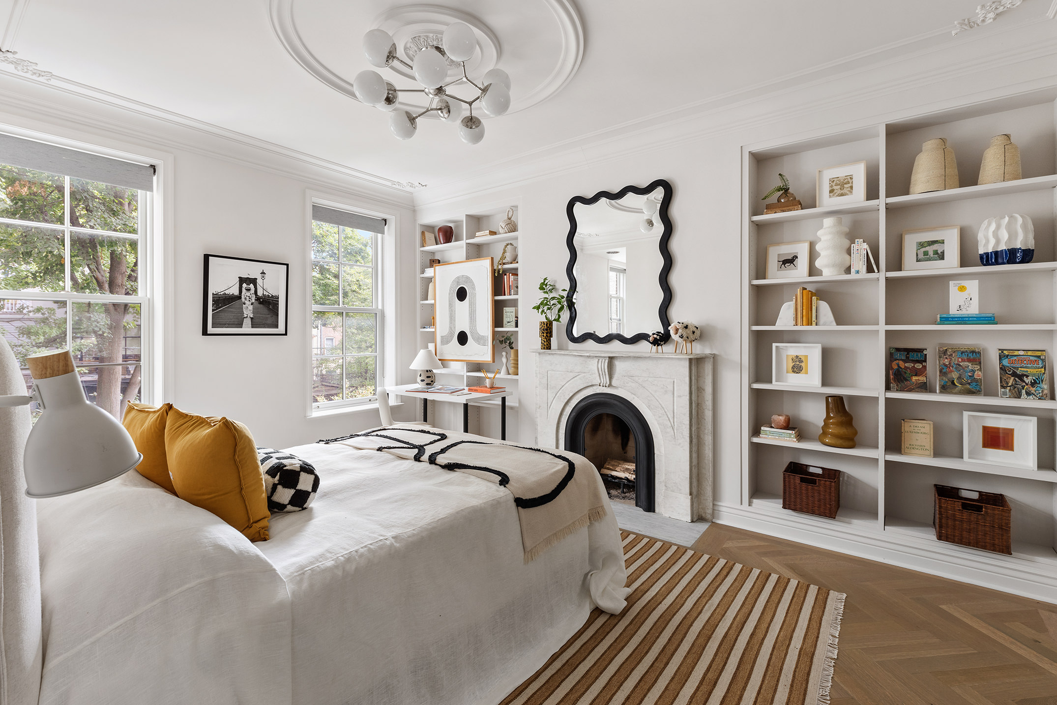 439 Sackett Street Brooklyn, NY 11231 - Photo 16 of 25 a bedroom with a large bed and a book shelf