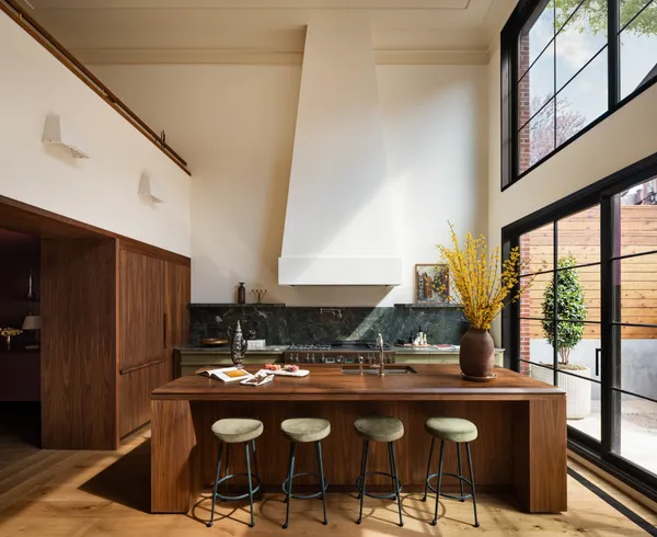 a kitchen with stainless steel appliances granite countertop a sink and a refrigerator
