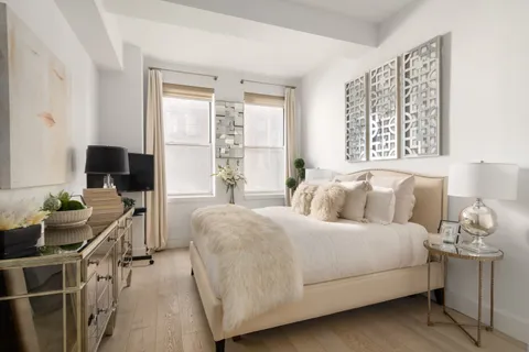 a bedroom with a bed and furniture