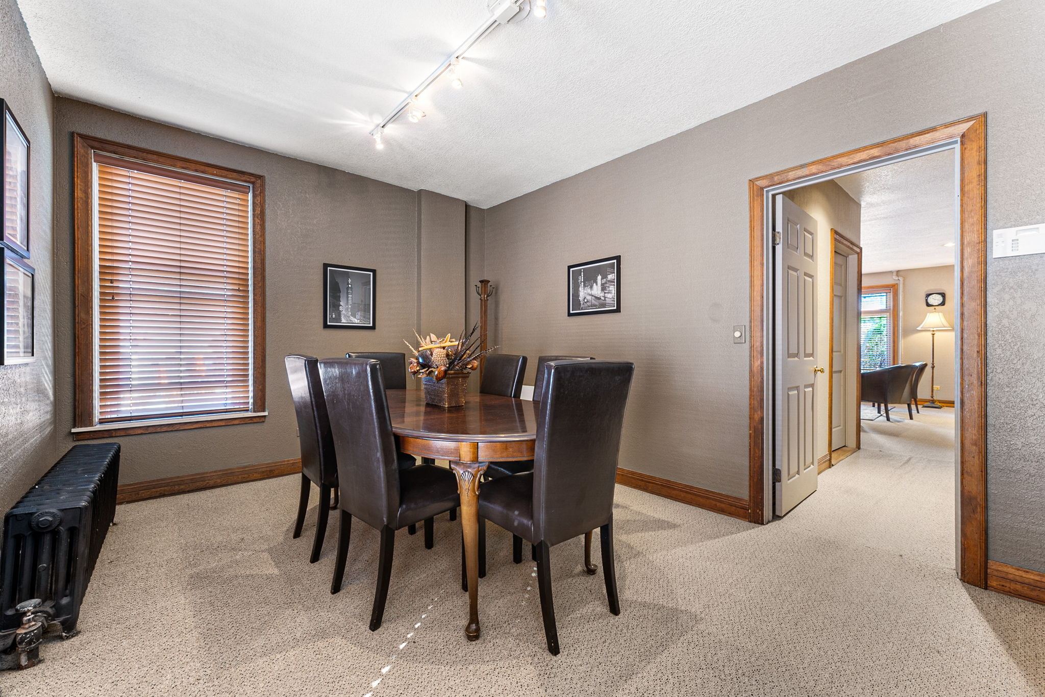 681 Grant Street Denver, CO 80203 - Photo 9 of 15 a view of a dining room with furniture and window
