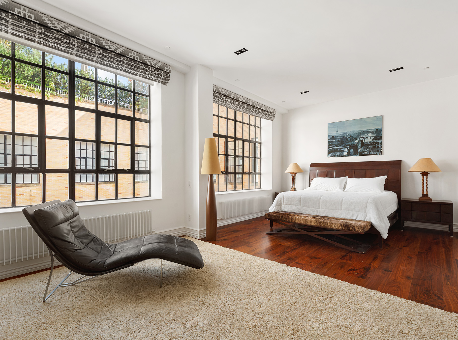 73 Wooster Street, Unit PHA Manhattan, NY 10012 - Photo 14 of 25 a spacious bedroom with a bed and wooden floor