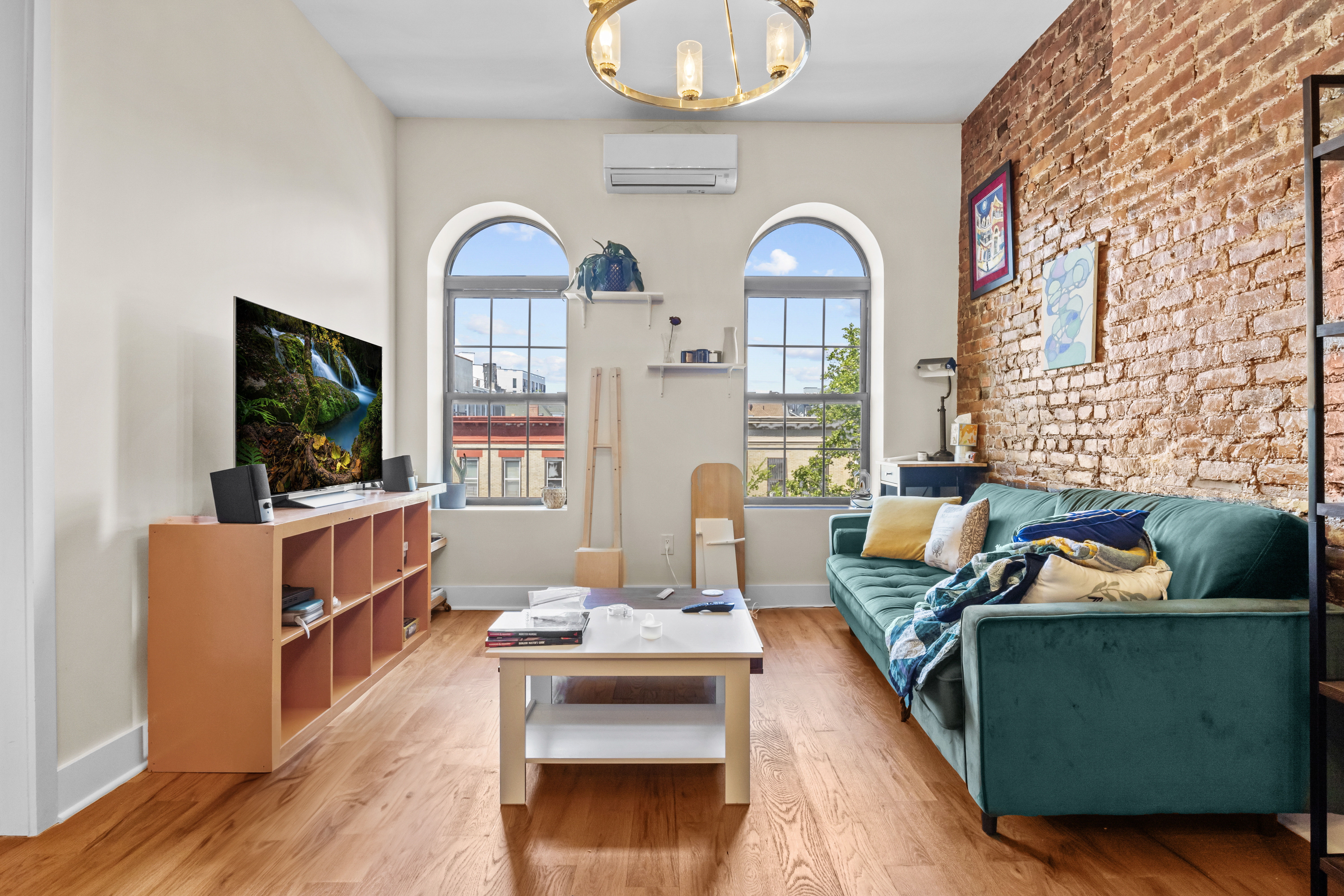 1273 Rogers Avenue, Unit MULTIFAM Brooklyn, NY 11226 - Photo 2 of 13 a living room with furniture and a flat screen tv