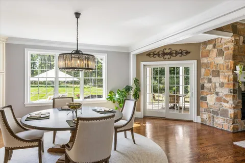 a view of a dining room with furniture window and outside view