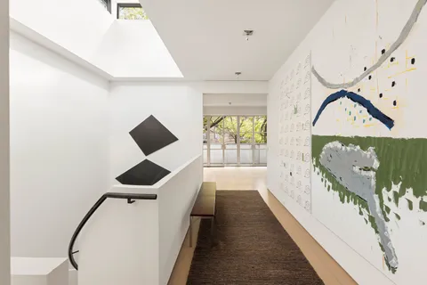 a view of a livingroom with furniture and natural light