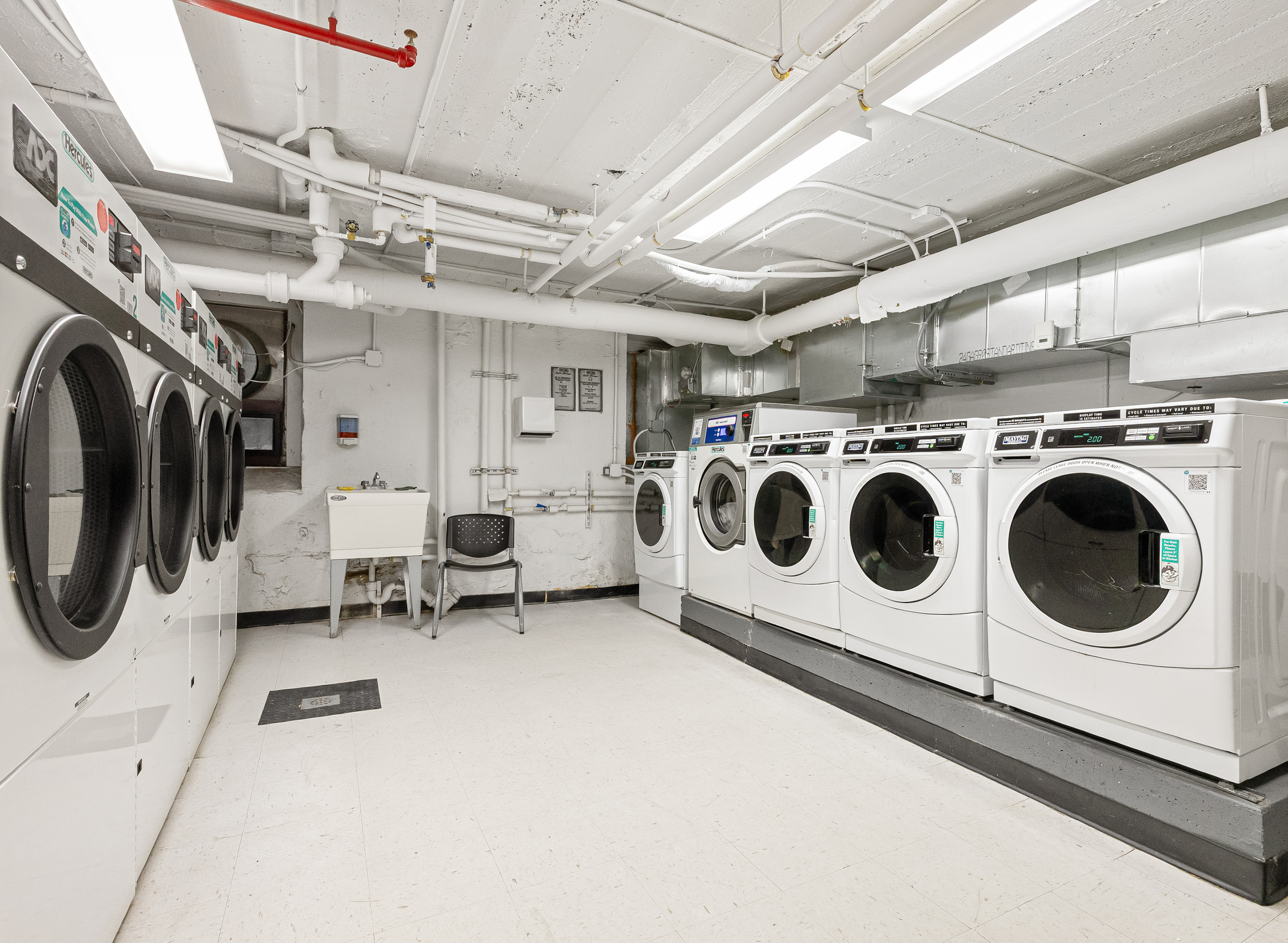 78 8th Avenue, Unit 2K Brooklyn, NY 11215 - Photo 9 of 10 a utility room with dryer and washer