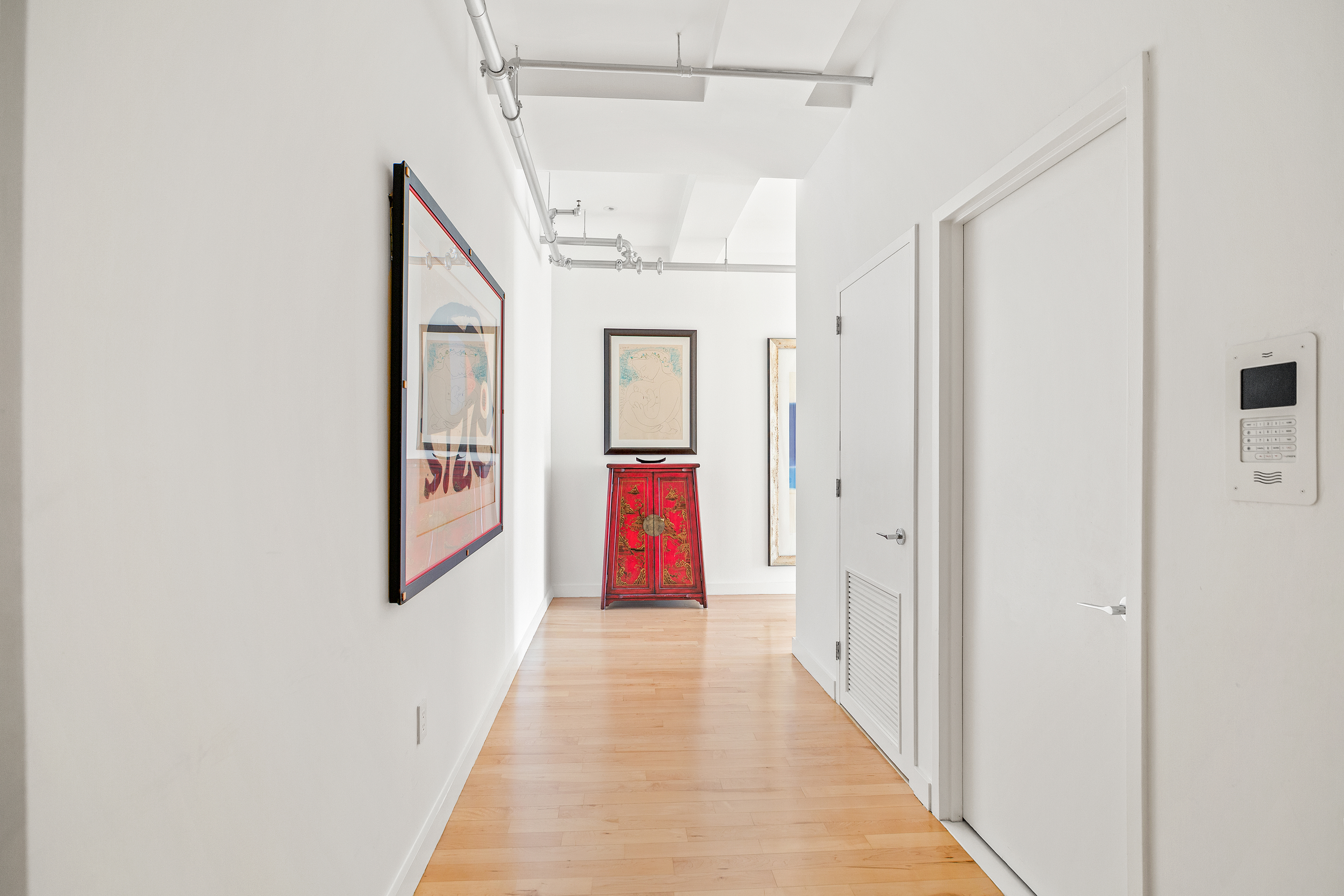 15 Broad Street, Unit 3120 Manhattan, NY 10005 - Photo 4 of 15 a view of a hallway with wooden floor