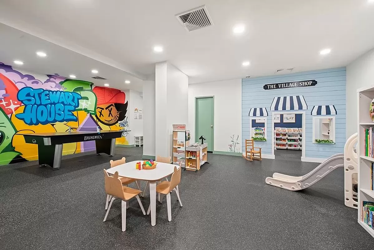 70 East 10th Street, Unit 3M Manhattan, NY 10003 - Photo 12 of 14 a living room with furniture and kitchen view