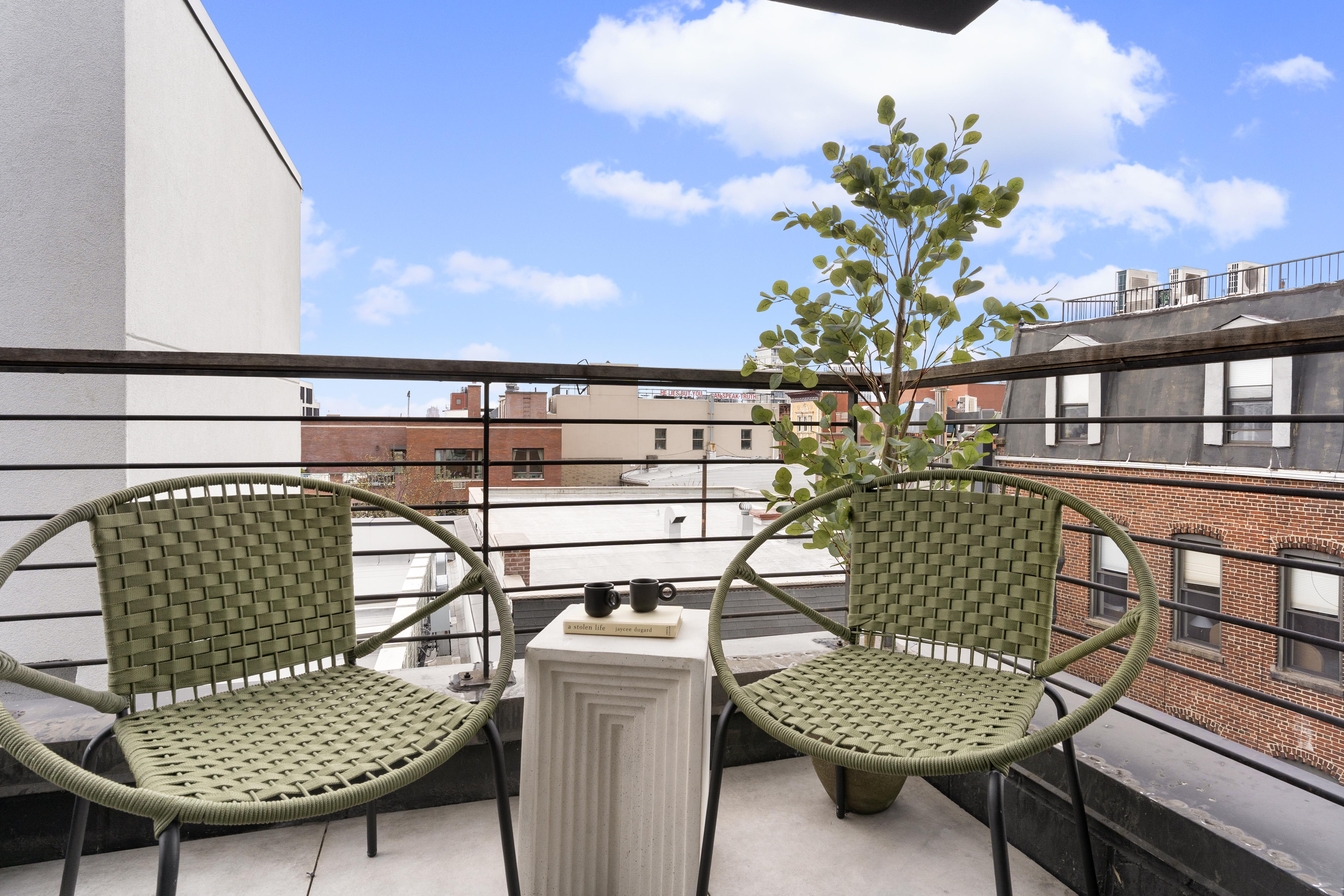142 North 1st Street, Unit PH Brooklyn, NY 11249 - Photo 14 of 15 a view of balcony with a potted plant and outdoor seating