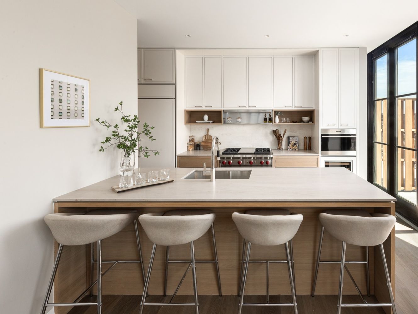 250 West 96th Street, Unit 20D Manhattan, NY 10025 - Photo 5 of 34 a kitchen with a dining table chairs and white cabinets