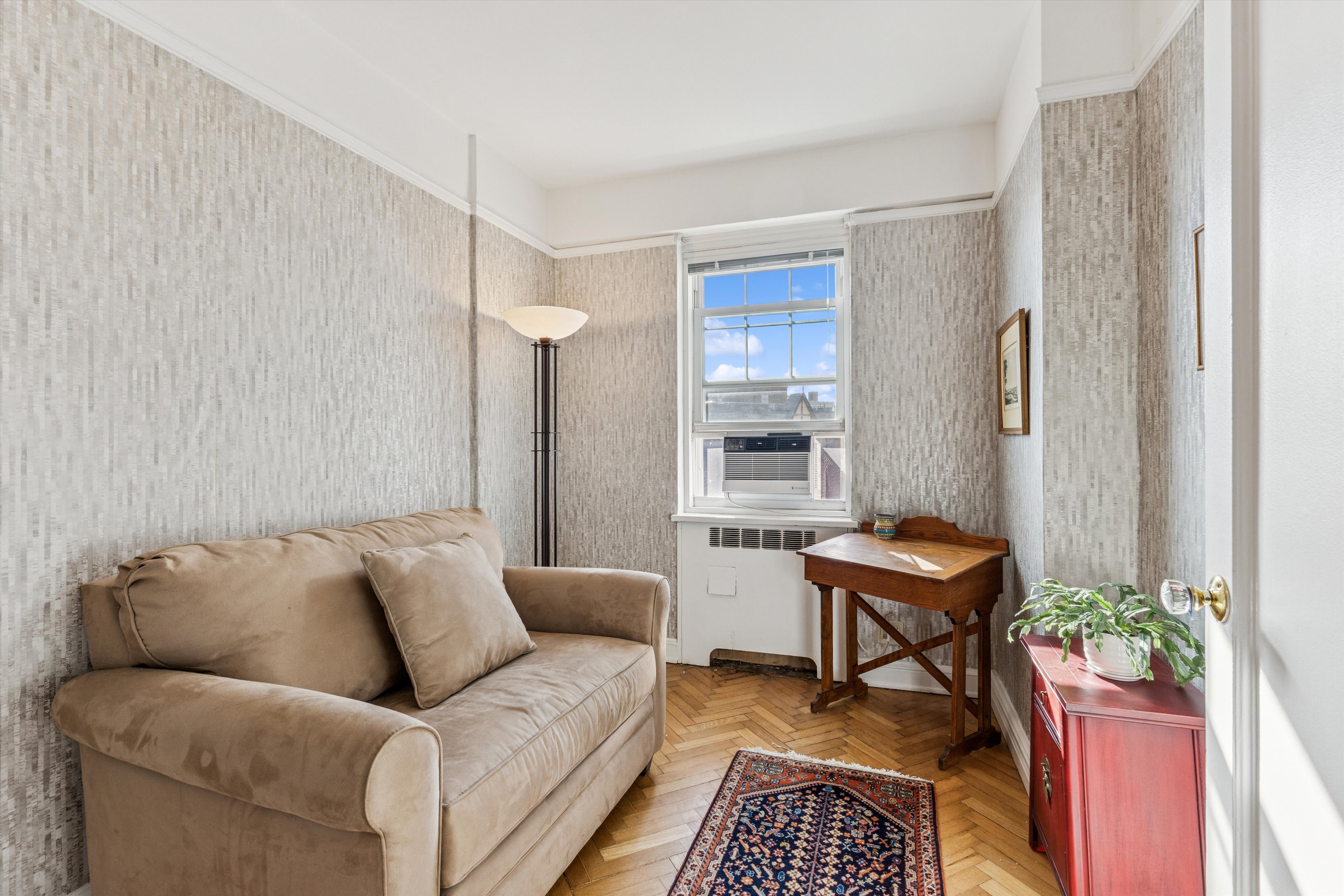 200 Cabrini Boulevard, Unit 86 Manhattan, NY 10033 - Photo 8 of 26 a living room with furniture and a rug