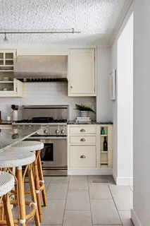 a kitchen with stainless steel appliances granite countertop a stove and a sink