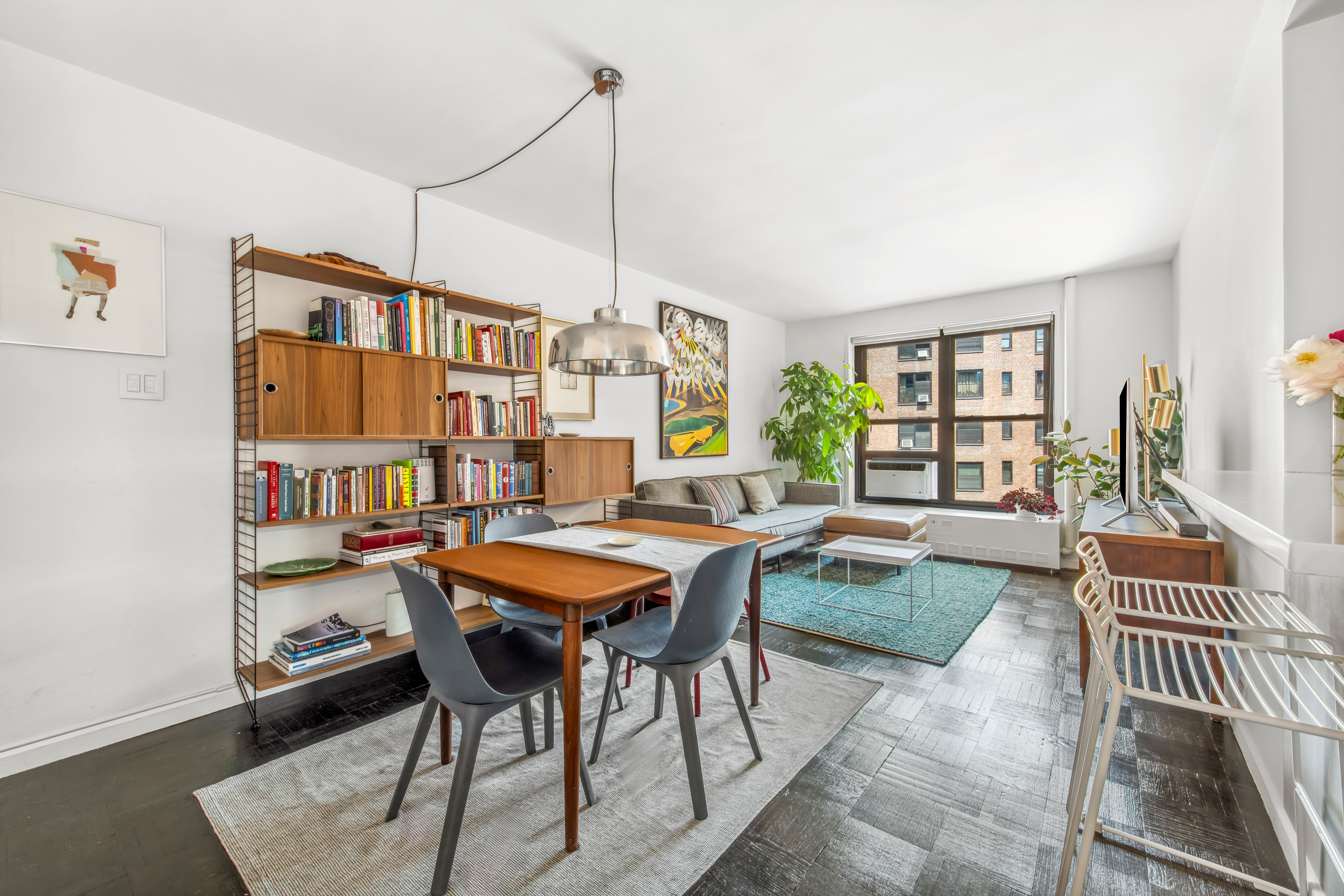 201 Clinton Avenue, Unit 10F Brooklyn, NY 11205 - Photo 2 of 11 a living room with furniture a rug and a window