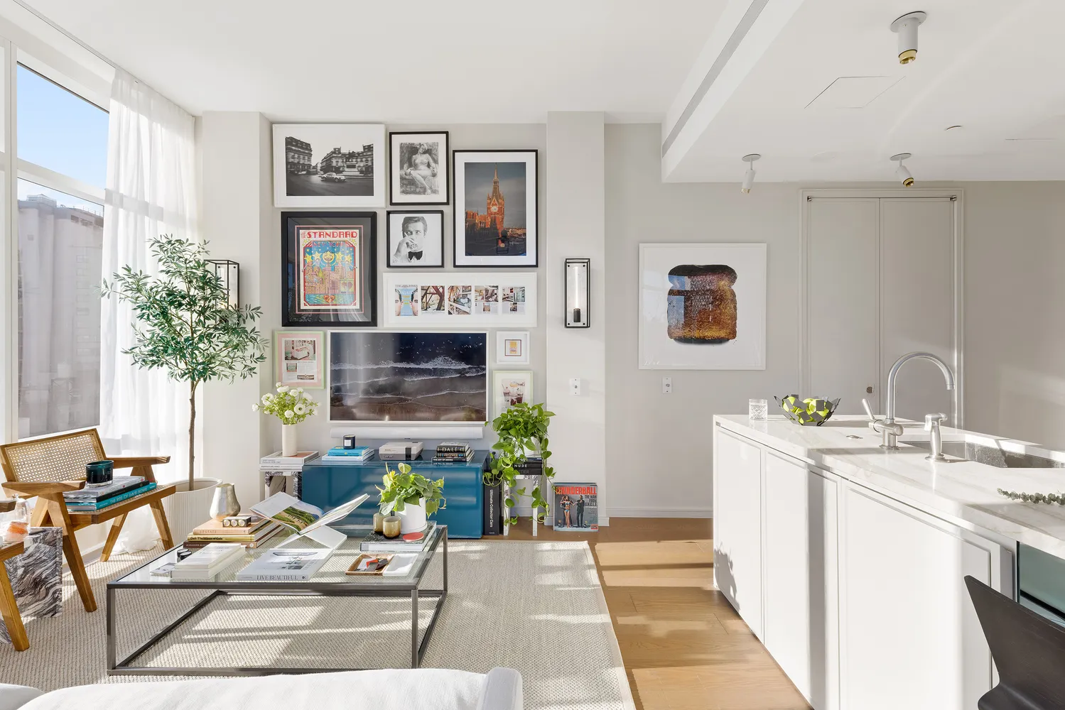 a living room with furniture a fireplace and a potted plant