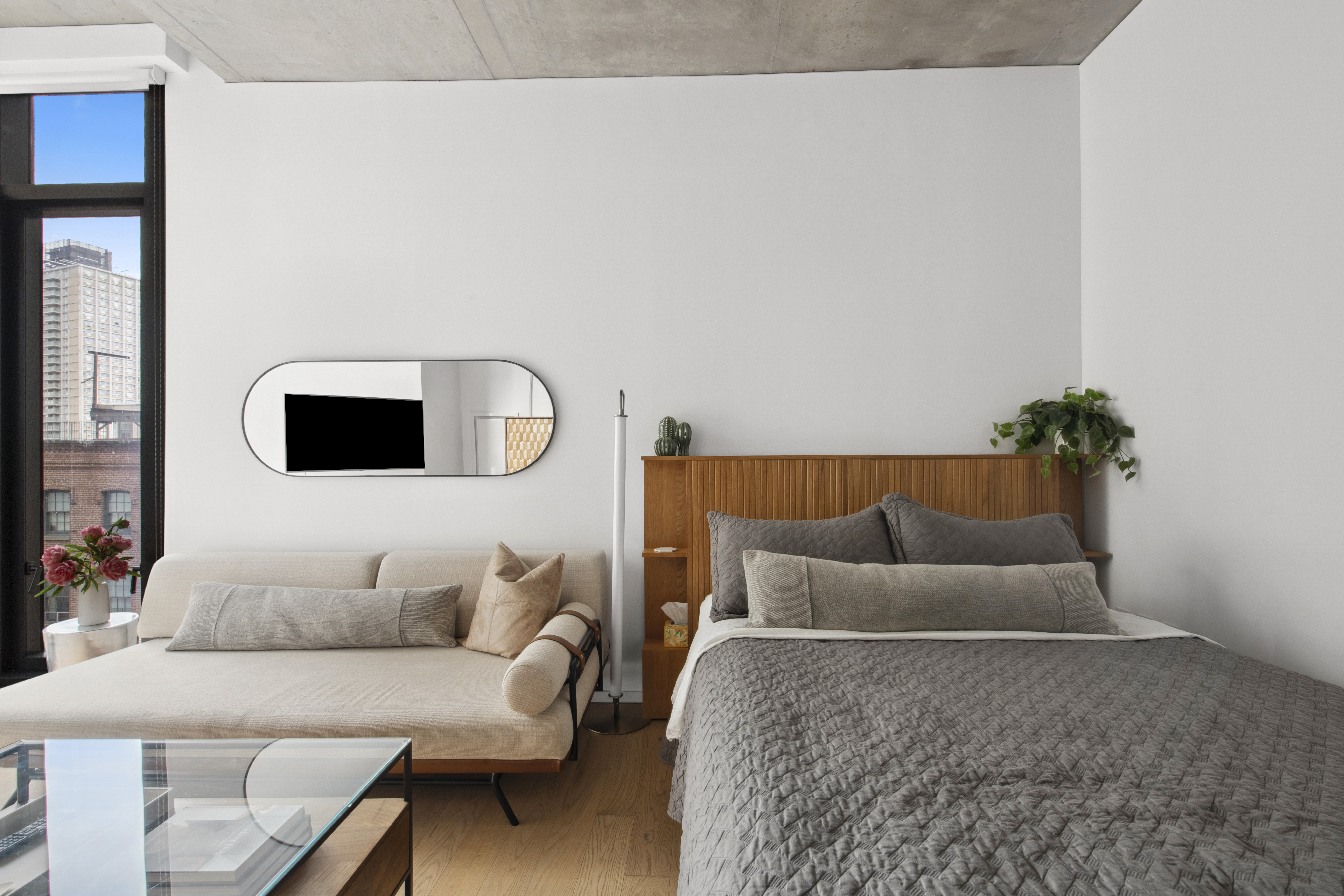 98 Front Street, Unit 9S Brooklyn, NY 11201 - Photo 2 of 7 a living room with furniture and a couch