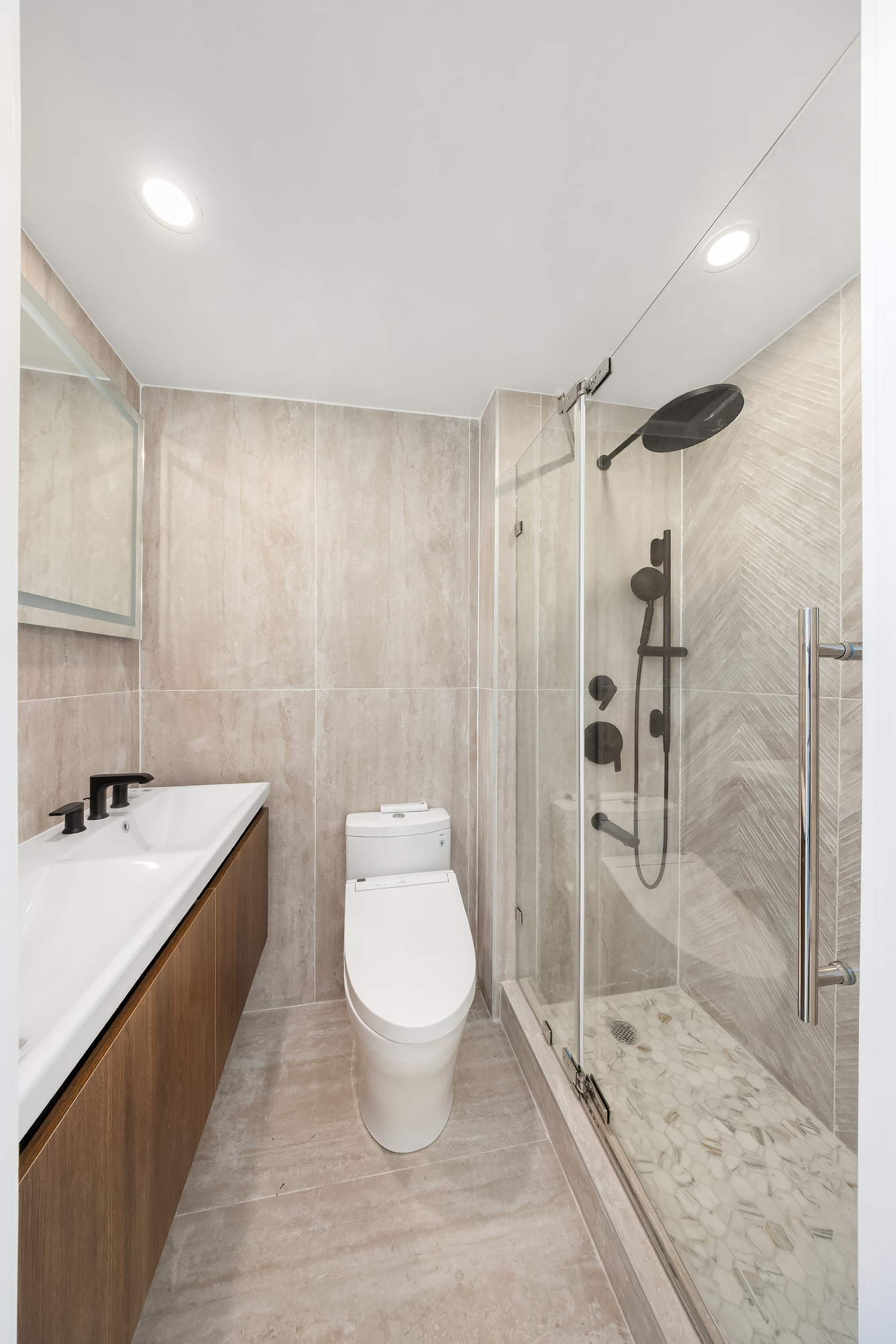 90 Herbert Street, Unit PHB Brooklyn, NY 11222 - Photo 13 of 15 a bathroom with a granite countertop sink a toilet a mirror and shower