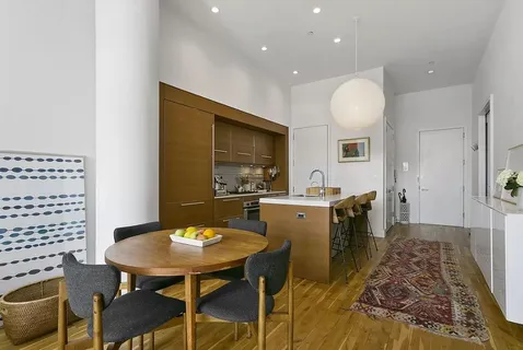 a kitchen with a table and chairs in it