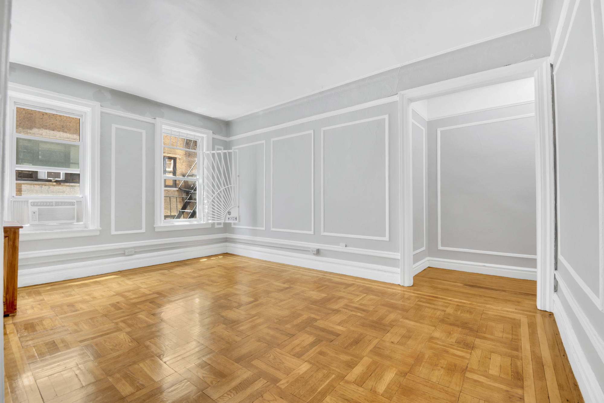 720 West 173rd Street, Unit 23 Manhattan, NY 10032 - Photo 3 of 10 a view of an empty room with a window