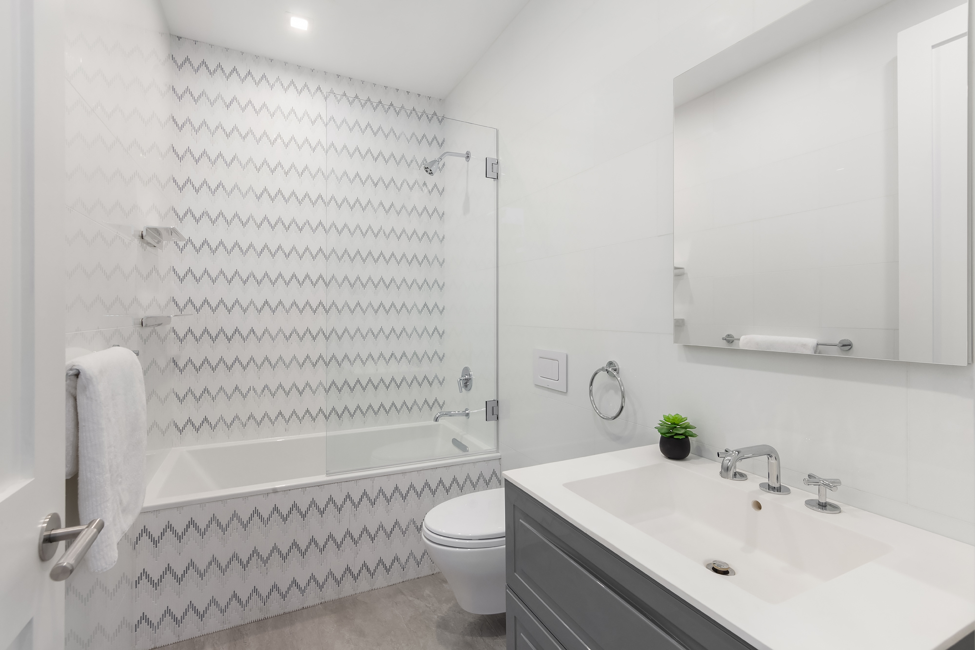 130 East 38th Street Manhattan, NY 10016 - Photo 9 of 16 a bathroom with a bathtub shower sink and toilet