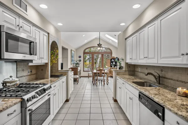 a view of a dining room with furniture window and outside view