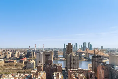 a view of a city with tall buildings in the background