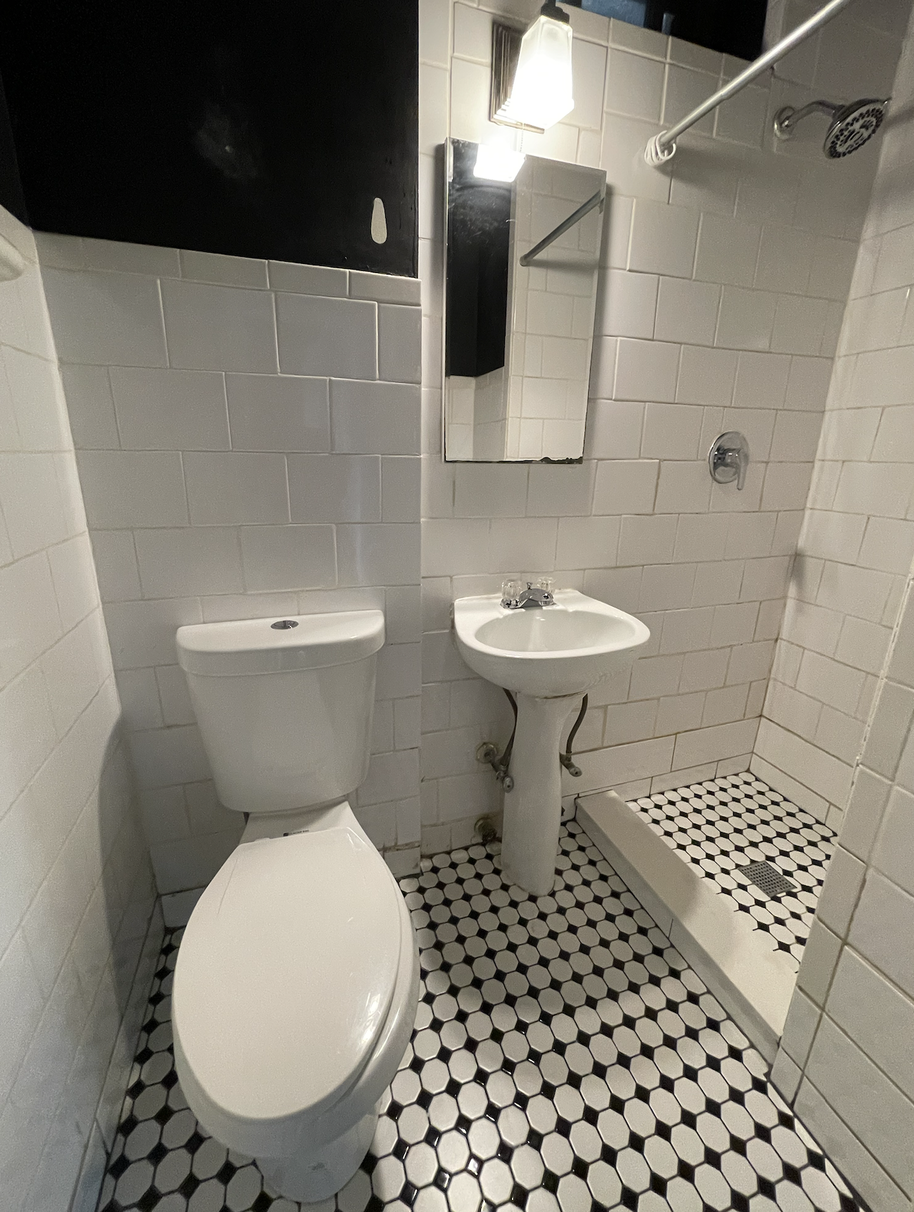 266 West 22nd Street, Unit 2 Manhattan, NY 10011 - Photo 10 of 14 a bathroom with a toilet a sink and mirror