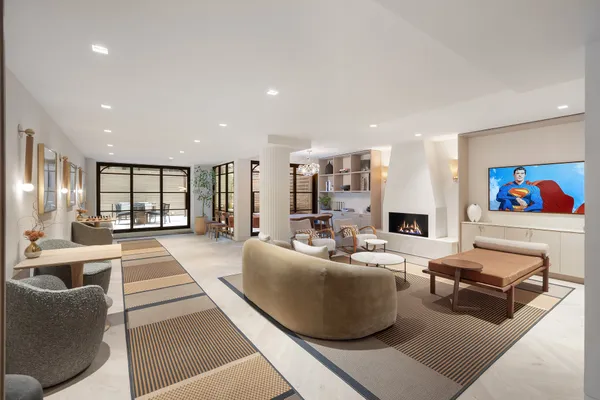 a kitchen with stainless steel appliances granite countertop a sink and a refrigerator