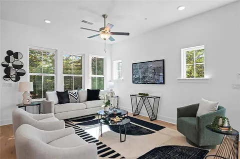 a living room with furniture and a large window