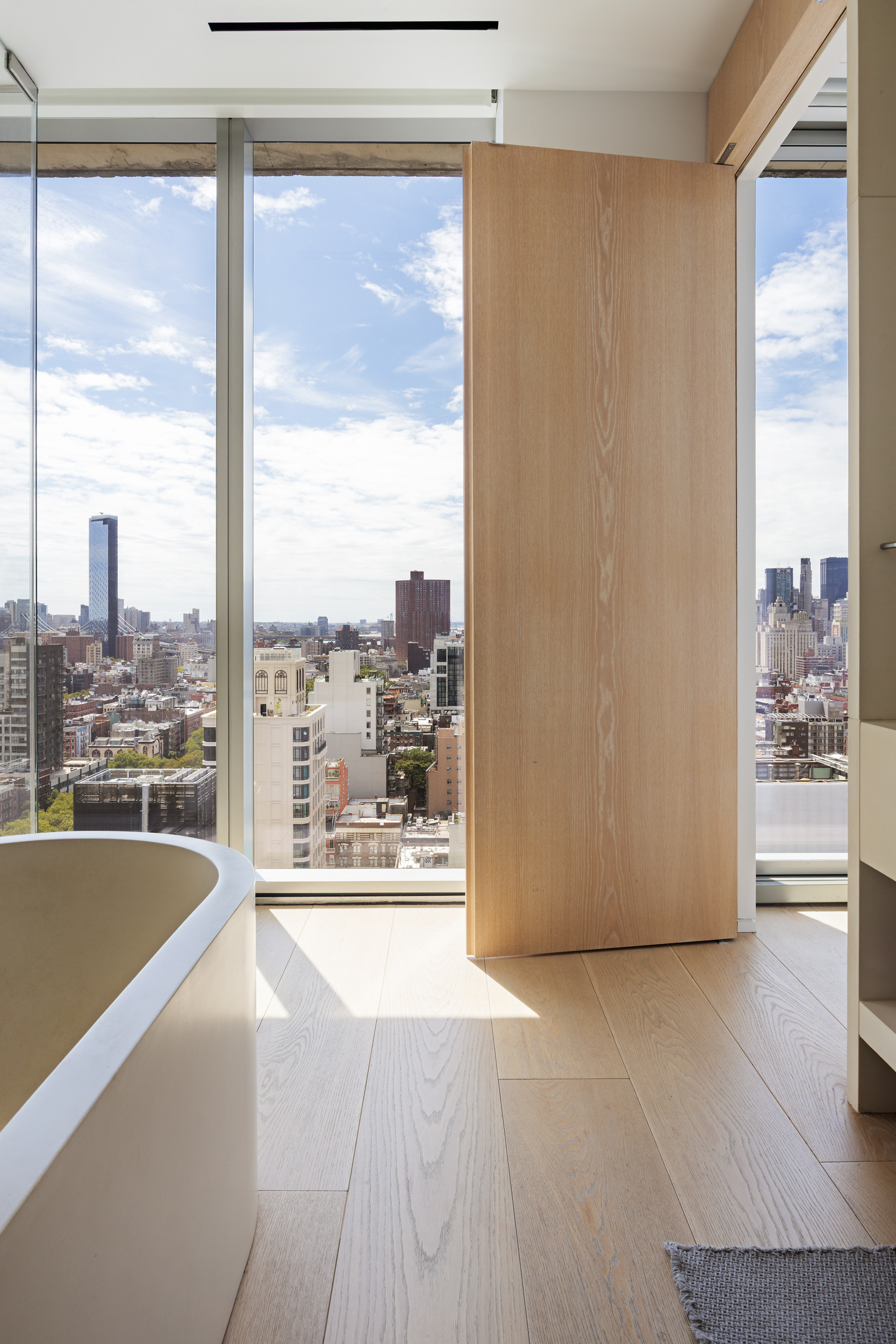 215 Chrystie Street, Unit 29W Manhattan, NY 10002 - Photo 15 of 24 a view of a kitchen with a large window