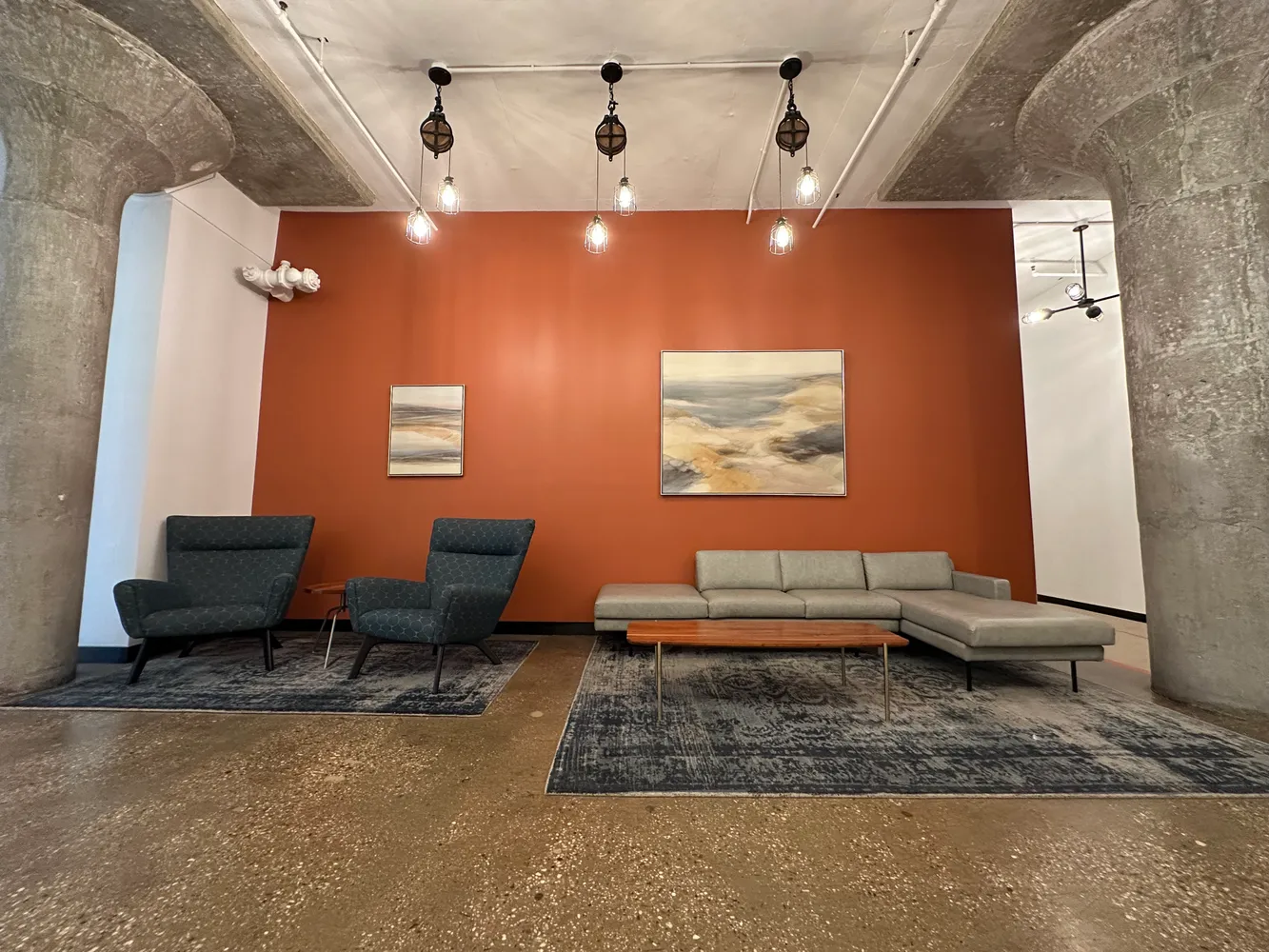 a living room with furniture and a rug