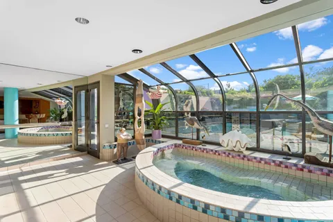 a view of a swimming pool with a patio