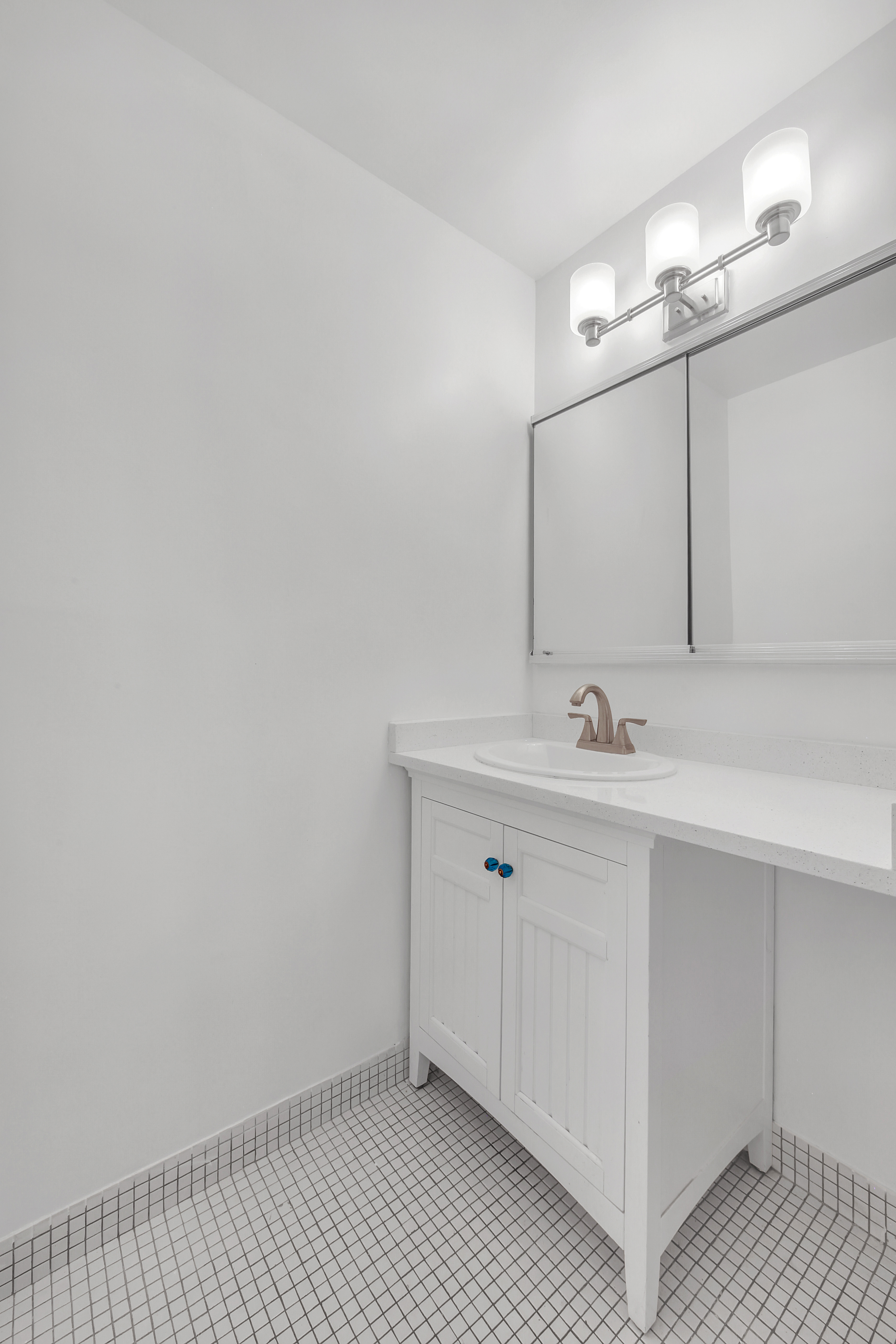 75 Livingston Street, Unit 9B Brooklyn, NY 11201 - Photo 12 of 13 a bathroom with a sink a vanity and a mirror