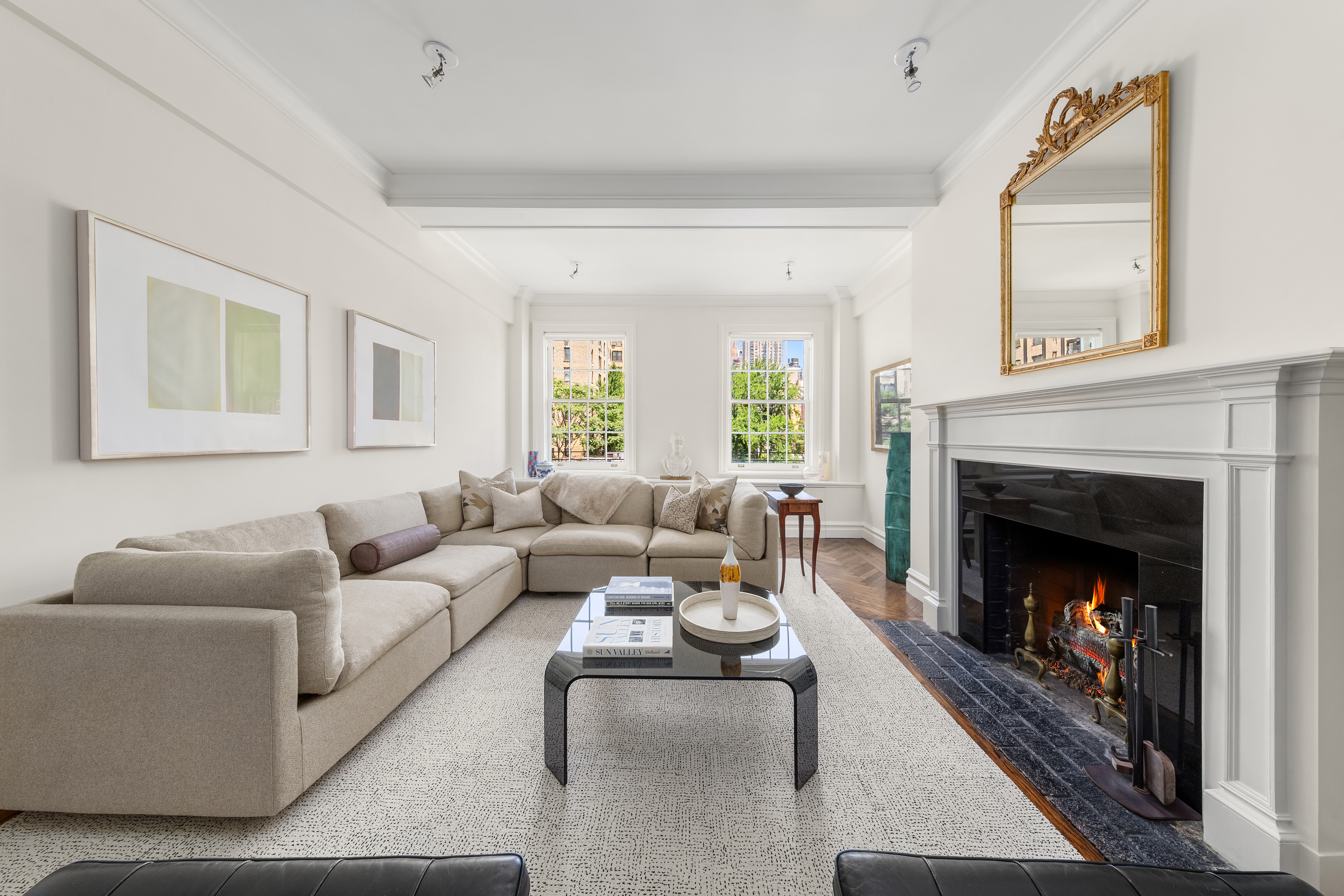 162 East 80th Street Manhattan, NY 10075 - Photo 1 of 13 a living room with furniture and a fireplace