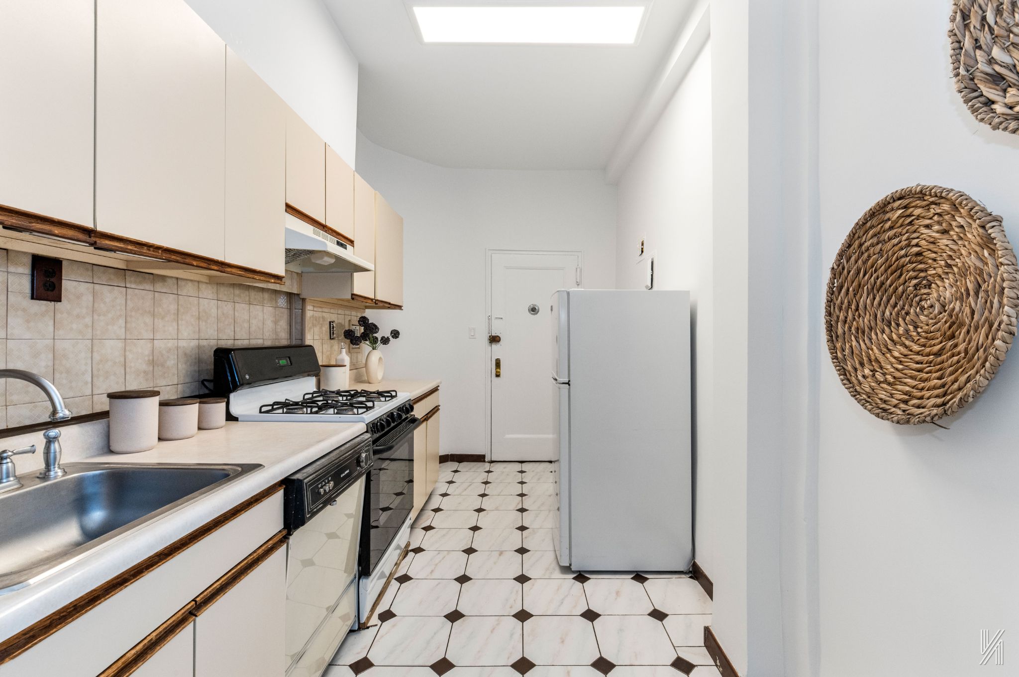 39-30 52nd Street, Unit GA Queens, NY 11377 - Photo 8 of 15 a kitchen with stainless steel appliances a sink a stove a refrigerator and cabinets