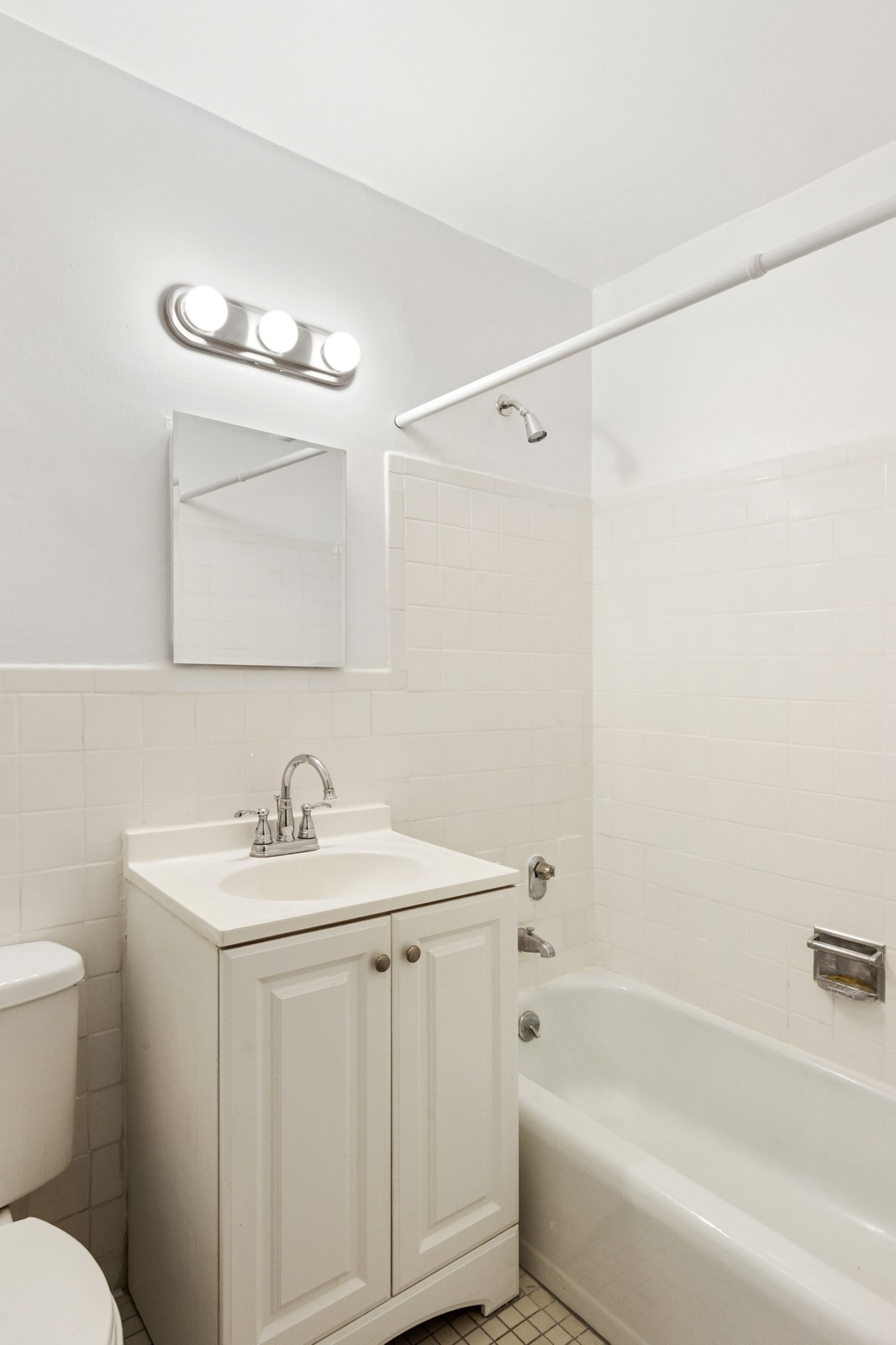 333 East 79th Street, Unit 9Y Manhattan, NY 10075 - Photo 7 of 11 a bathroom with a sink a toilet and shower