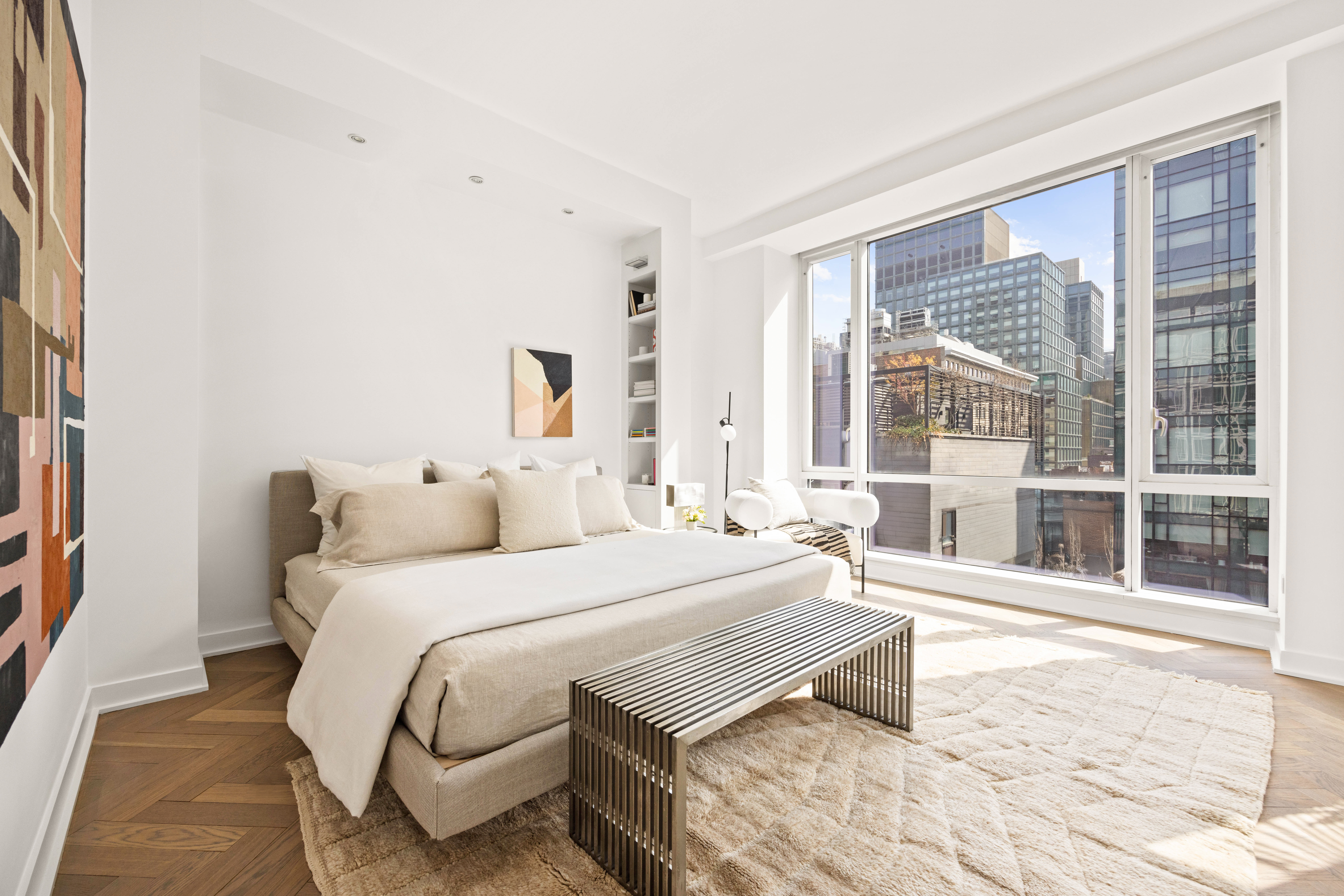 330 Spring Street, Unit 7D Manhattan, NY 10013 - Photo 7 of 11 a bedroom with a bed and a large window