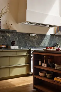 a kitchen with a stove and a microwave